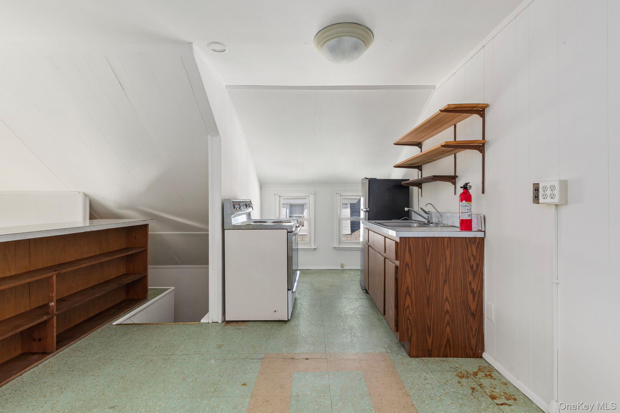 92-69 220th Street Queens, NY 11428 - Photo 24 of 33 a view of kitchen with cabinets and wooden floor