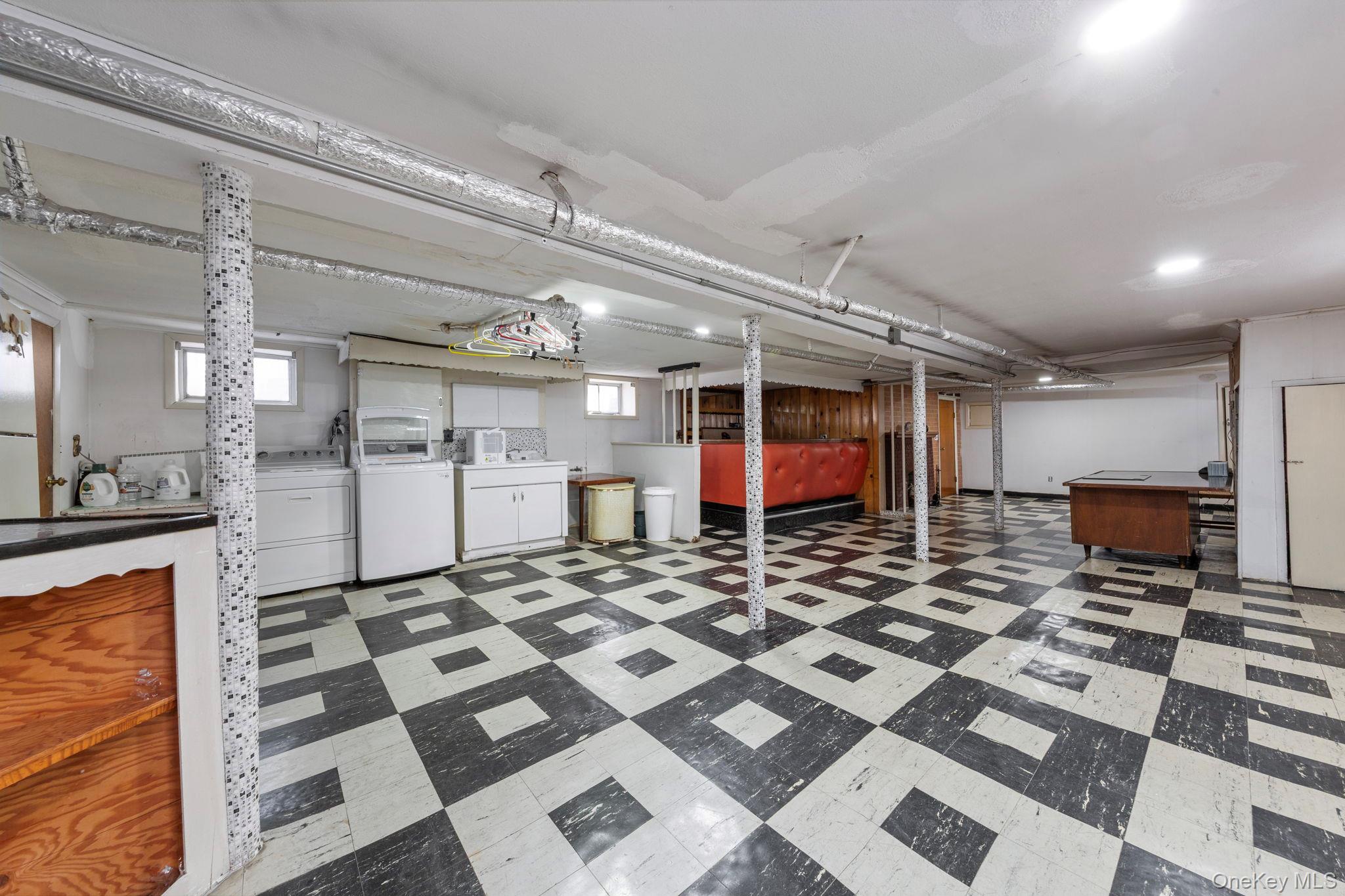 92-69 220th Street Queens, NY 11428 - Photo 26 of 33 a view of a electric appliances and wooden cabinets