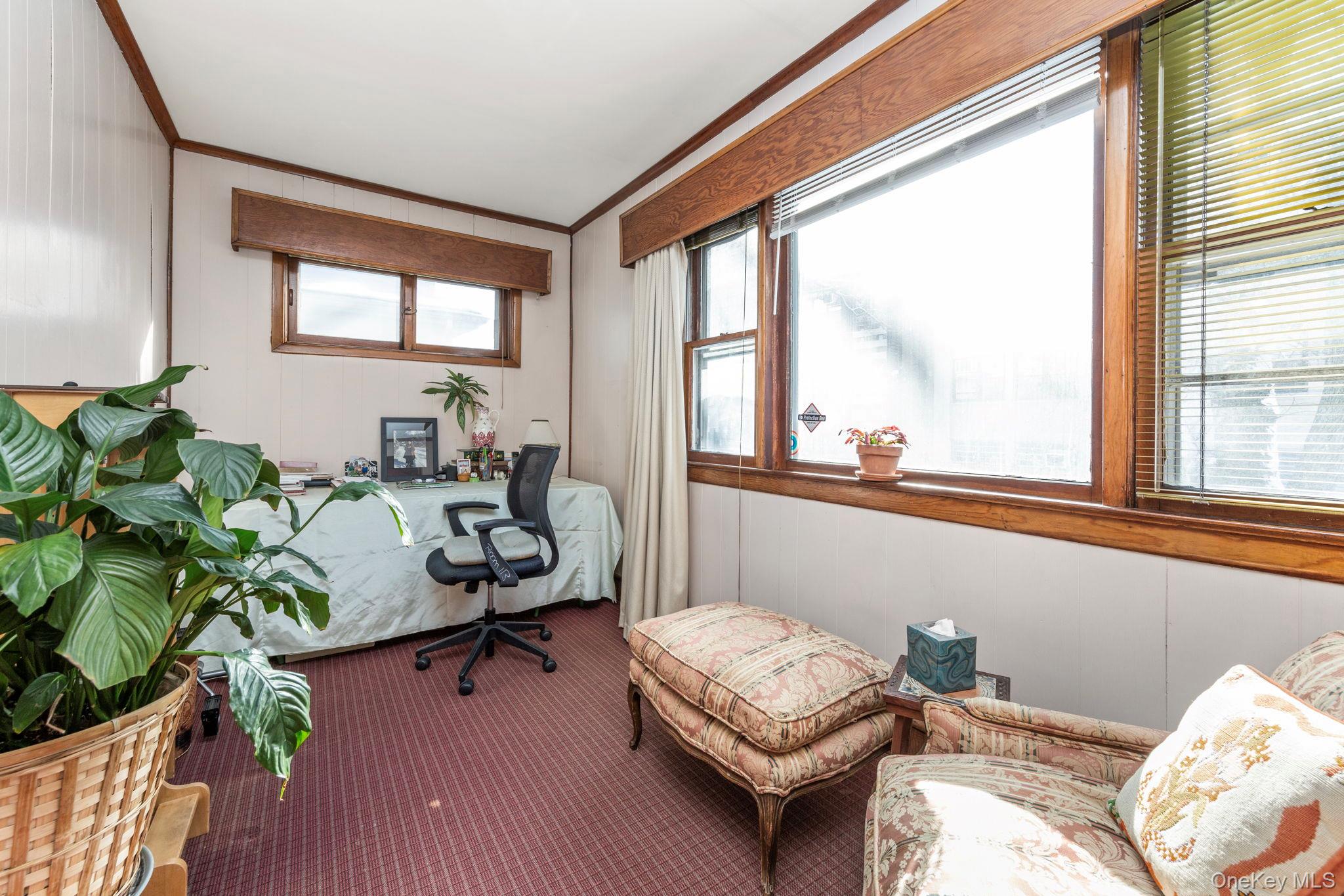 92-69 220th Street Queens, NY 11428 - Photo 6 of 33 a living room with furniture and a window