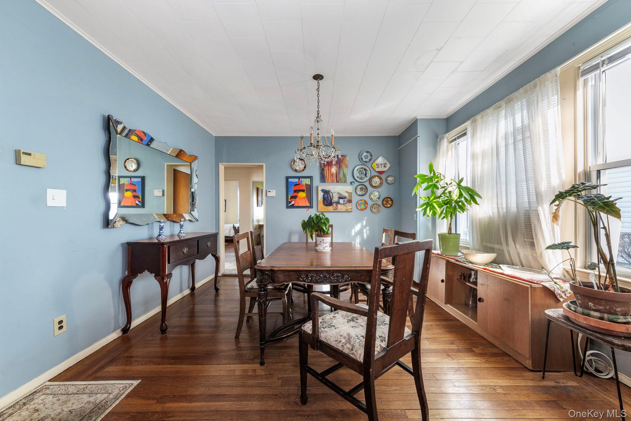92-69 220th Street Queens, NY 11428 - Photo 7 of 33 a view of a dining room with furniture window and wooden floor