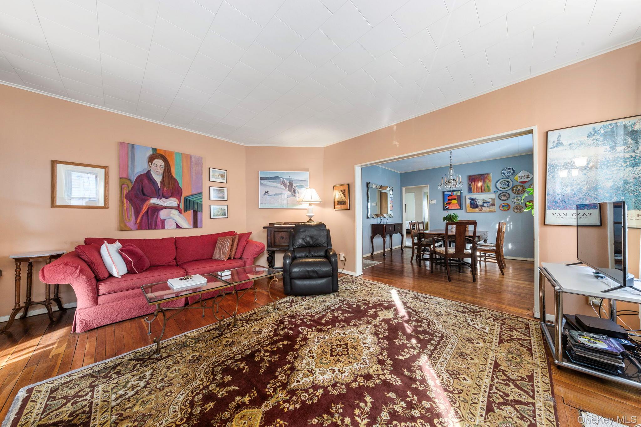 92-69 220th Street Queens, NY 11428 - Photo 8 of 33 a living room with furniture and a wooden floor