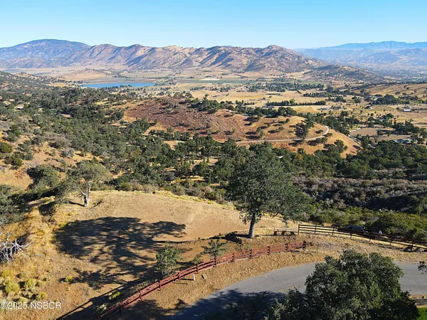 an aerial view of residential house and mountain