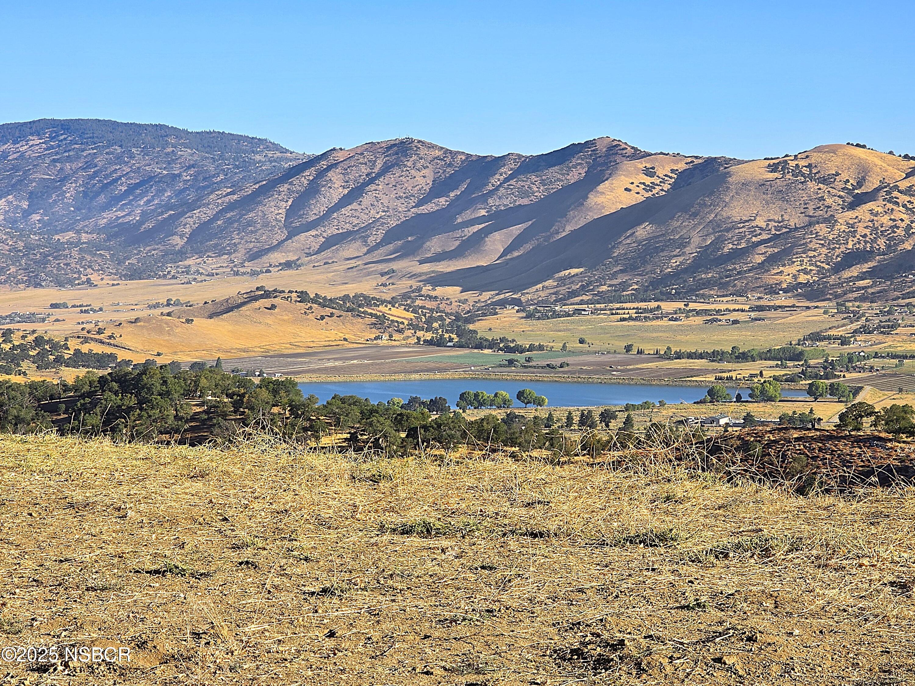 0 Zurich Drive Tehachapi, CA 93561 - Photo 18 of 52 a view of a large body of water with a mountain in the background