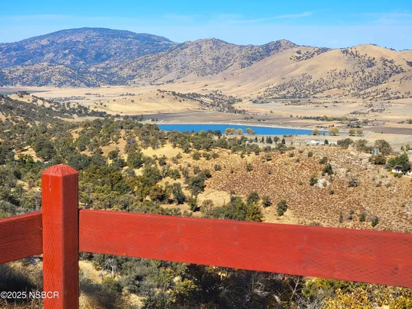 a view of a wooden floor and a floor to ceiling window