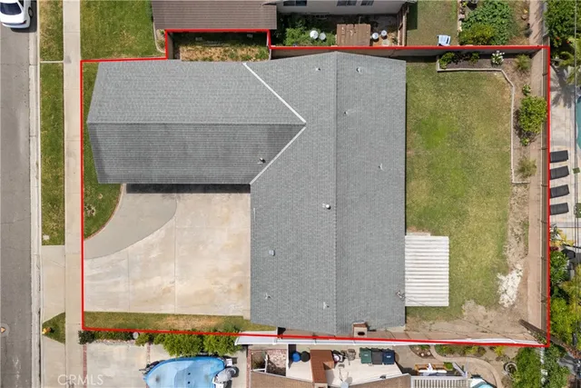 a view of a house next to a yard