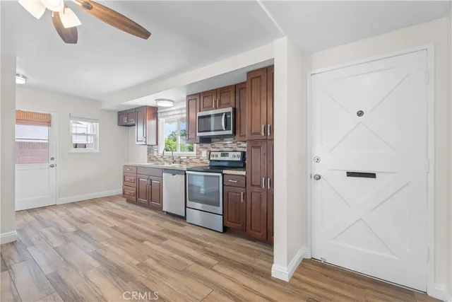 a view of an empty room and wooden floor