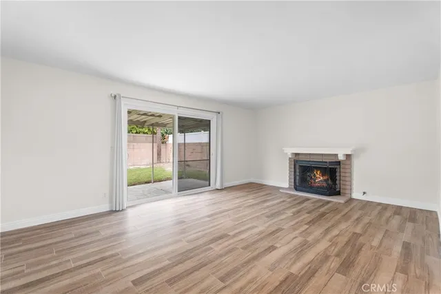 a view of kitchen with furniture and wooden floor