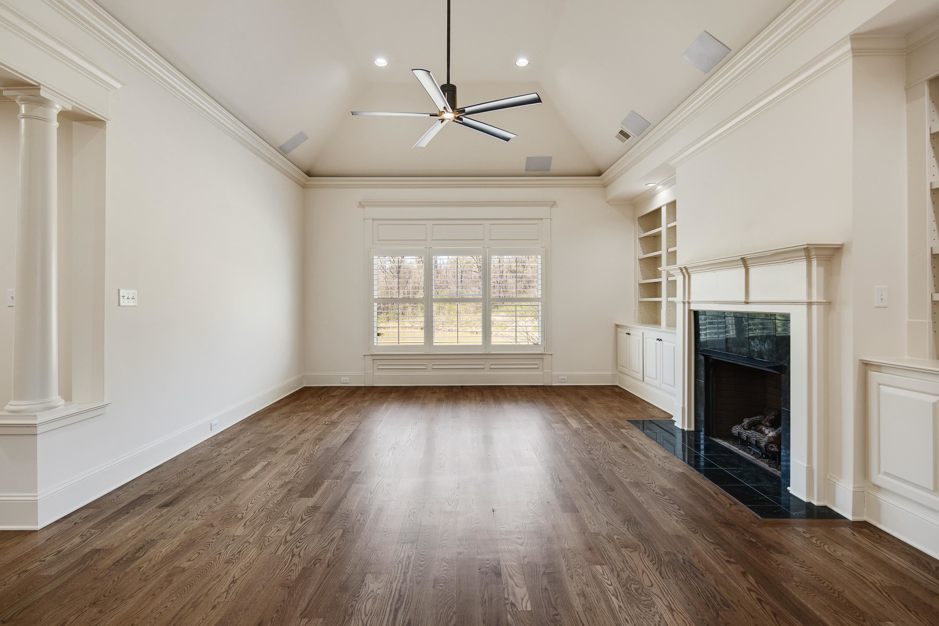 9110 Baynard Loop North Germantown, TN 38139 - Photo 11 of 40 a view of an empty room with a fireplace and a window