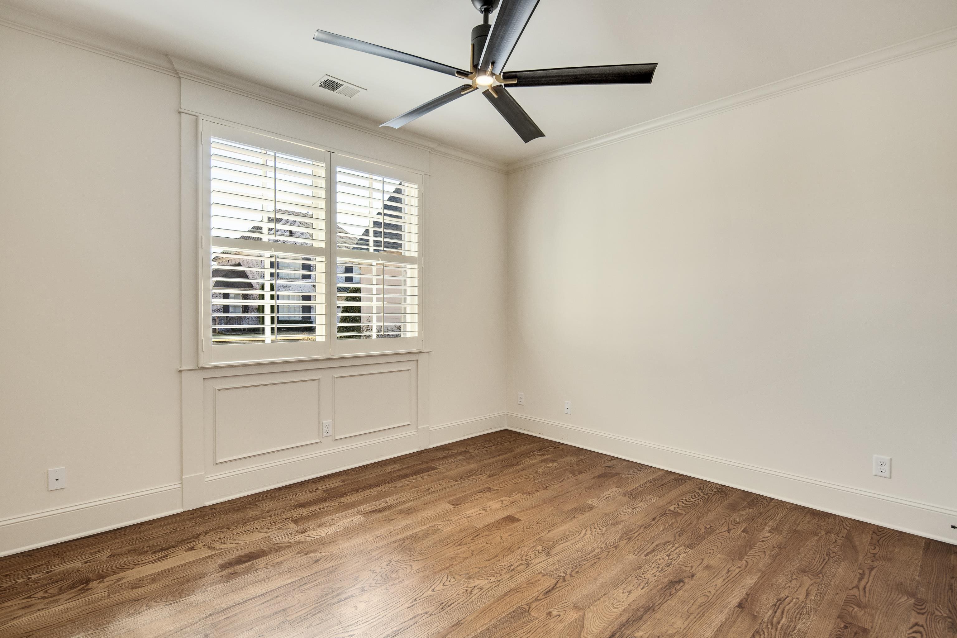9110 Baynard Loop North Germantown, TN 38139 - Photo 18 of 40 a view of empty room with wooden floor and fan