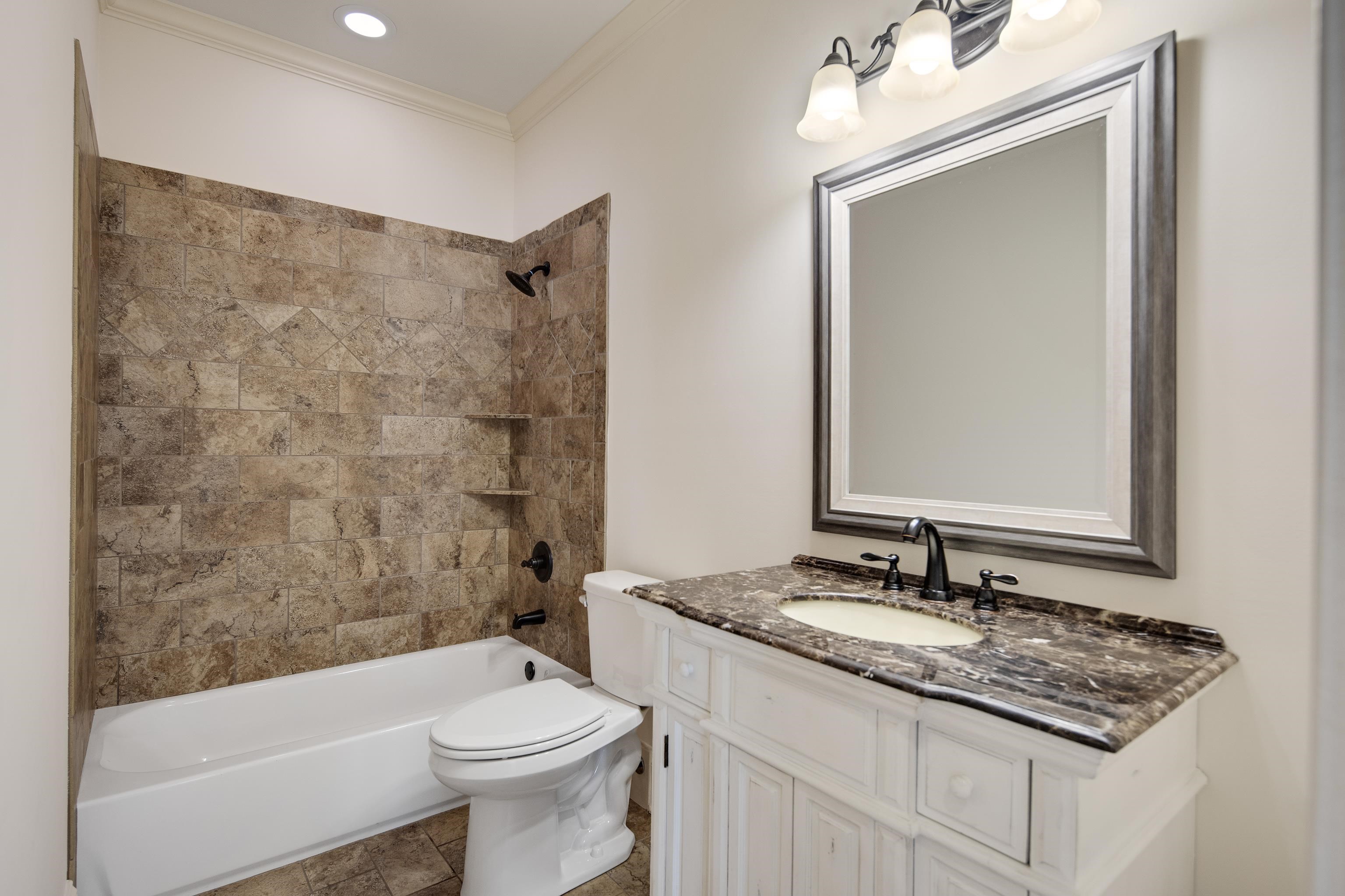 9110 Baynard Loop North Germantown, TN 38139 - Photo 20 of 40 a bathroom with a sink a toilet and shower