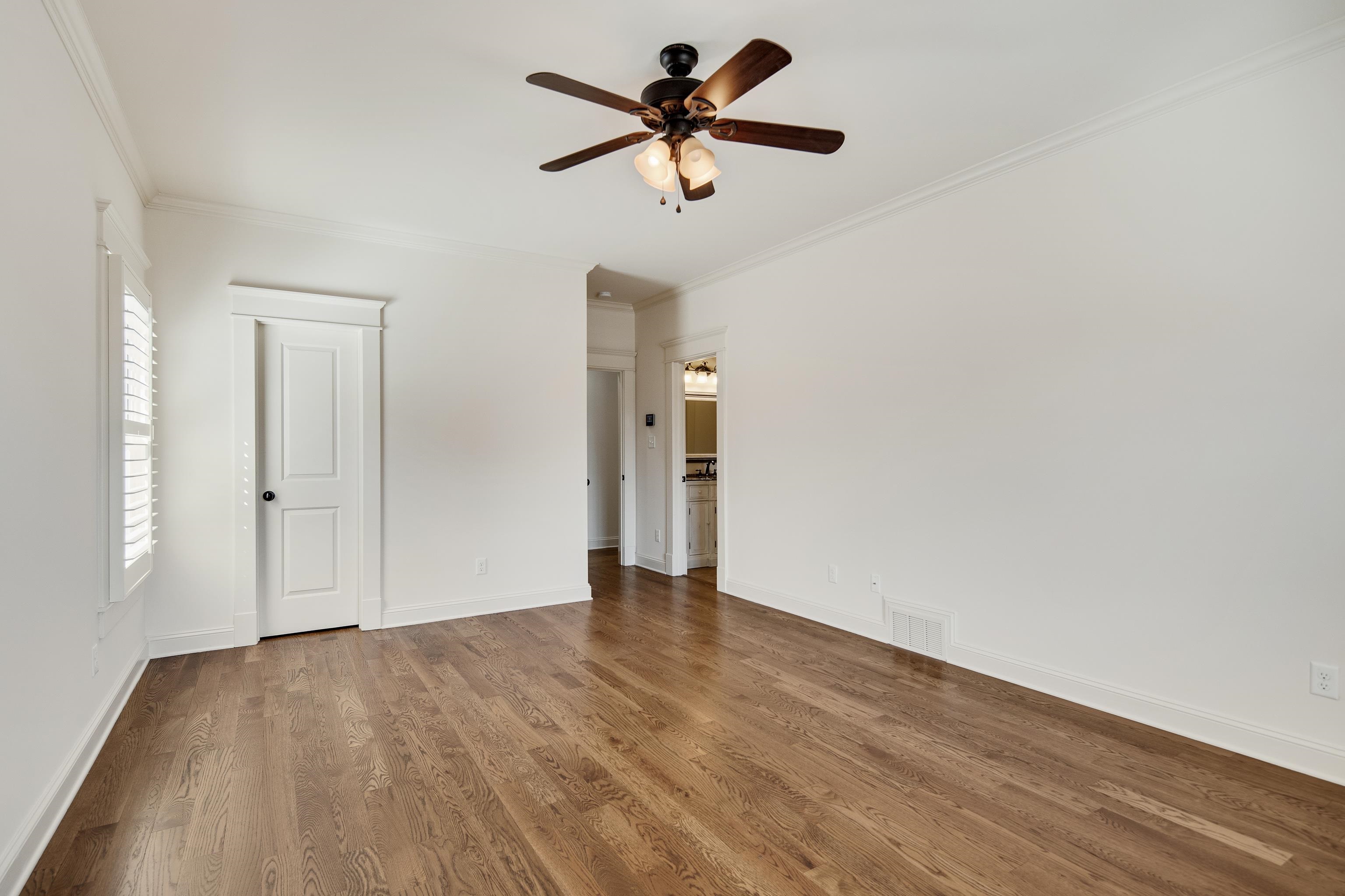 9110 Baynard Loop North Germantown, TN 38139 - Photo 30 of 40 a view of a room with wooden floor and a ceiling fan