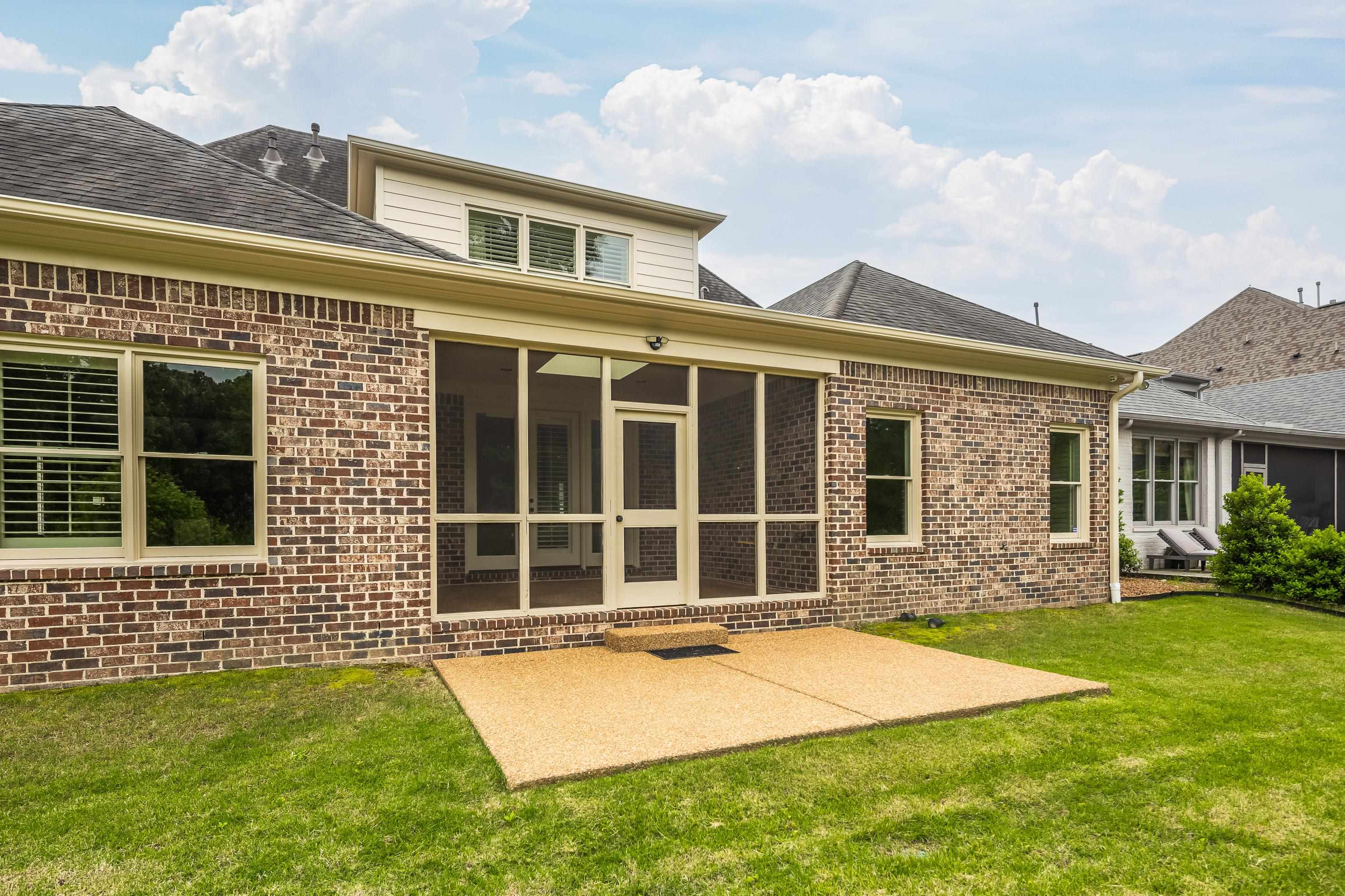 9110 Baynard Loop North Germantown, TN 38139 - Photo 34 of 40 a front view of a house with a yard
