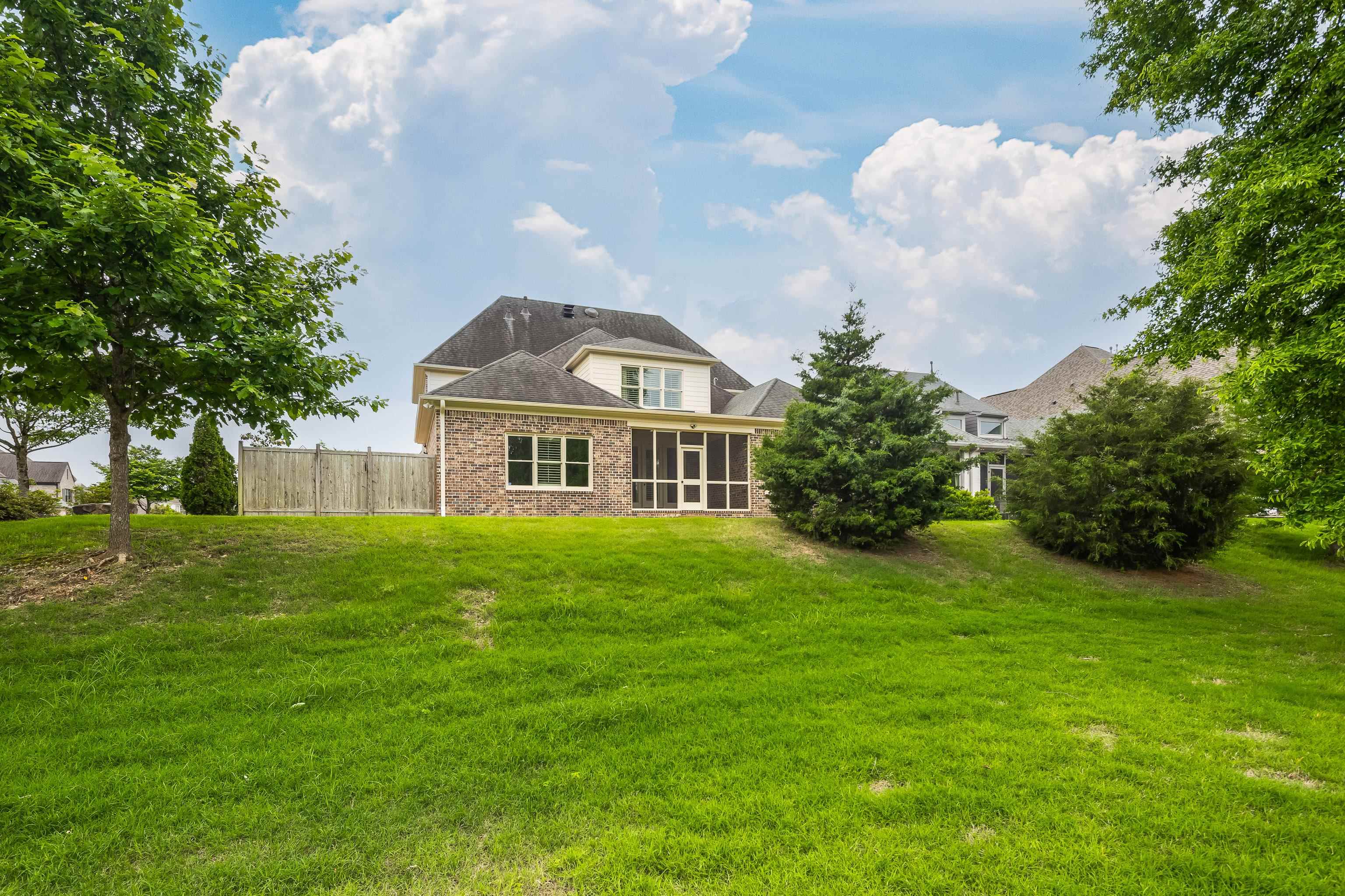 9110 Baynard Loop North Germantown, TN 38139 - Photo 35 of 40 a front view of a house with garden