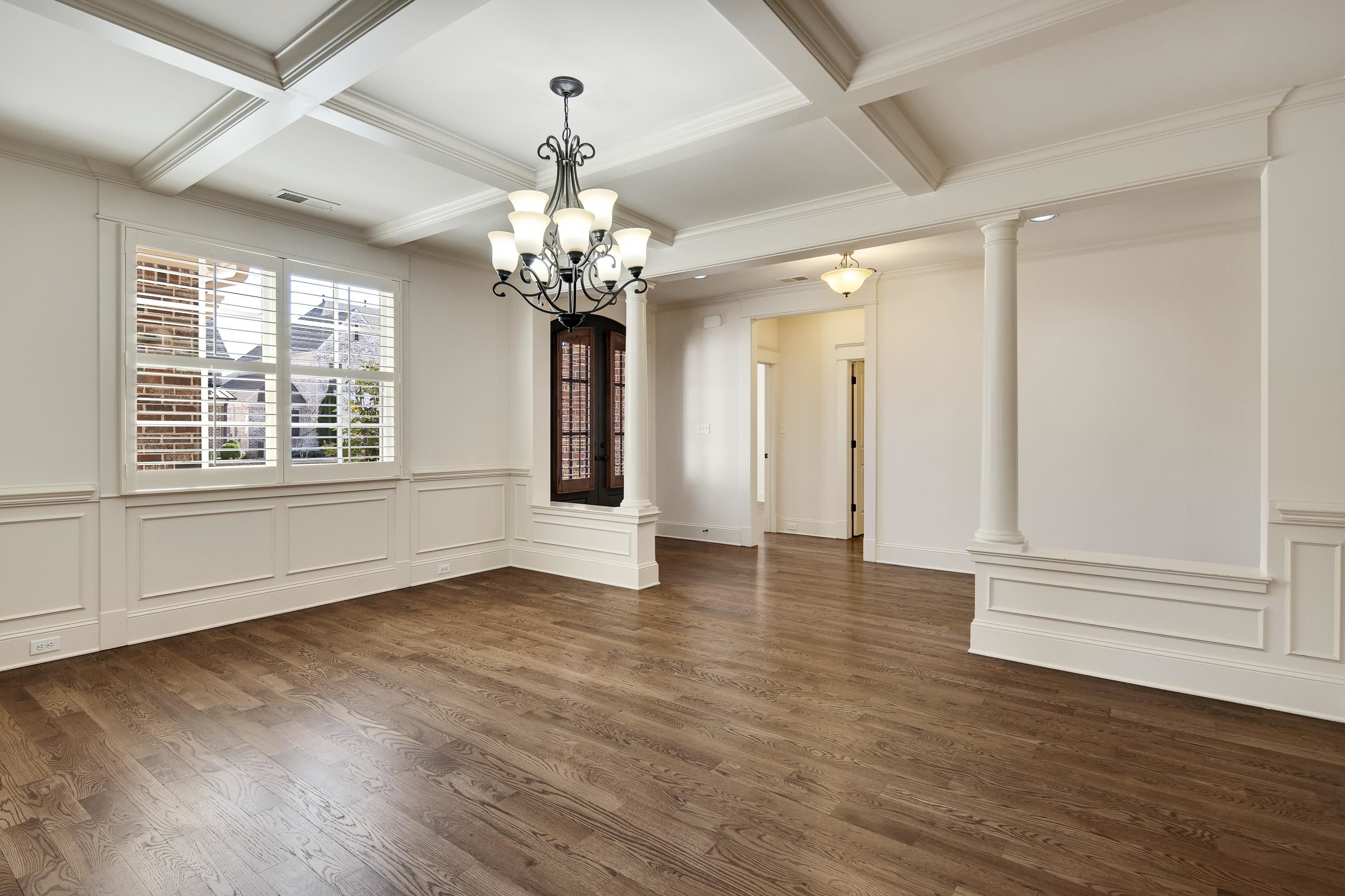 9110 Baynard Loop North Germantown, TN 38139 - Photo 7 of 40 a view of an empty room with wooden floor and a window