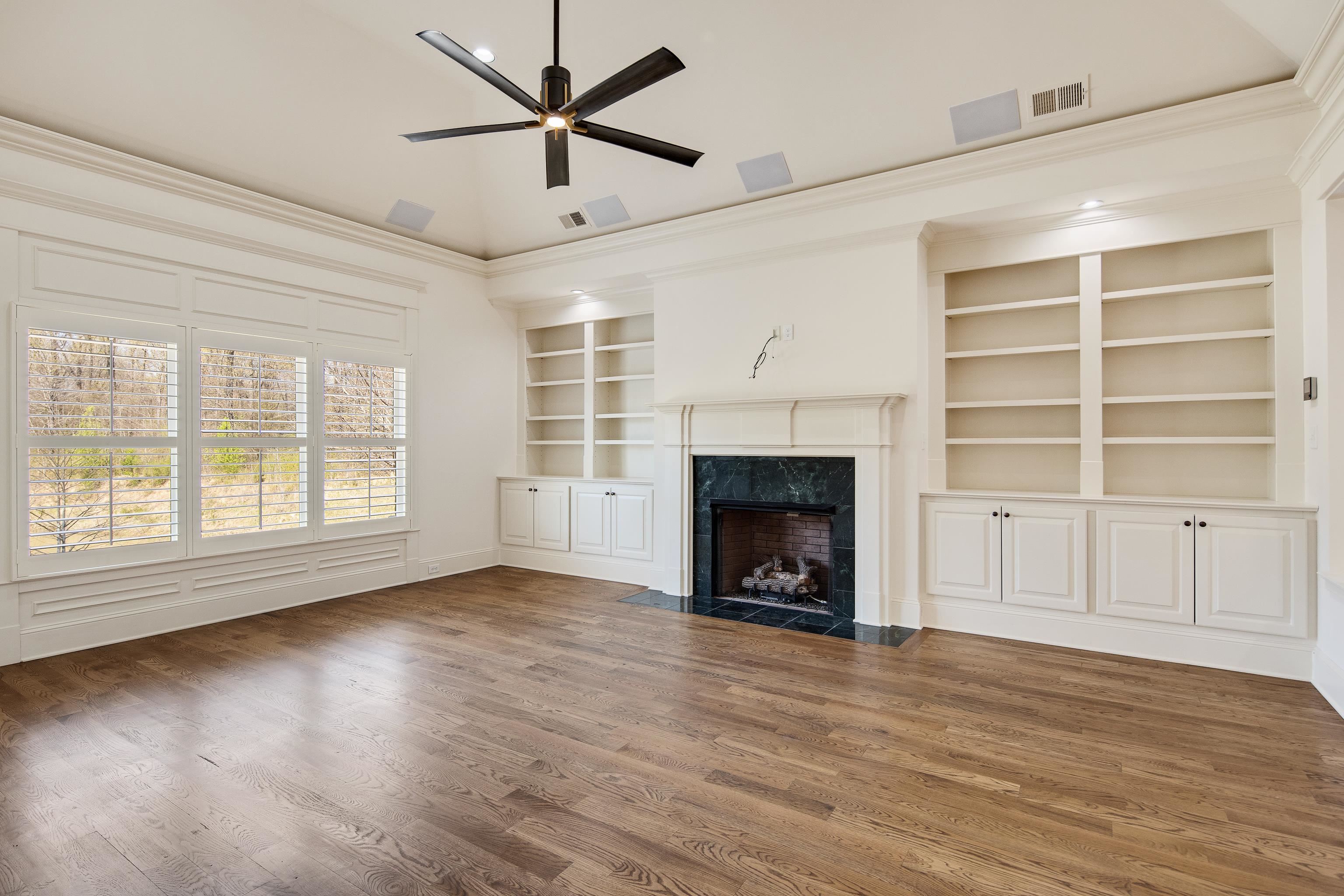 9110 Baynard Loop North Germantown, TN 38139 - Photo 10 of 40 a view of an empty room with a window and fireplace