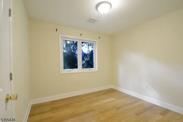 a bedroom with bed and a window