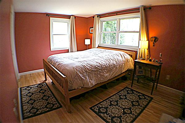 38 Toll Road Salisbury, MA 01952 - Photo 14 of 19 a bed sitting in a bedroom next to a window