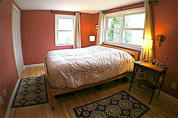 38 Toll Road Salisbury, MA 01952 - Photo 15 of 19 a bed sitting in a bedroom next to a window