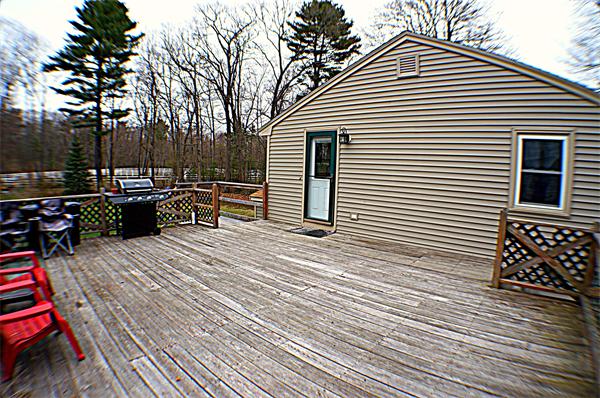 38 Toll Road Salisbury, MA 01952 - Photo 3 of 19 a view of a patio with couches chairs and wooden floor
