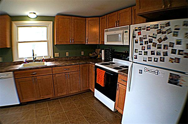 38 Toll Road Salisbury, MA 01952 - Photo 8 of 19 a kitchen with stainless steel appliances a stove a sink and a microwave