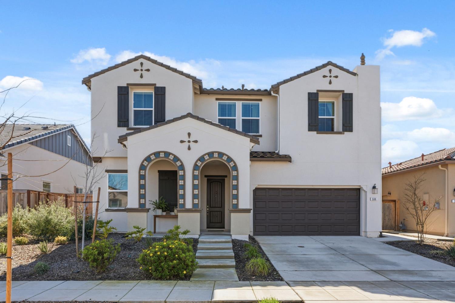 a front view of a house with yard
