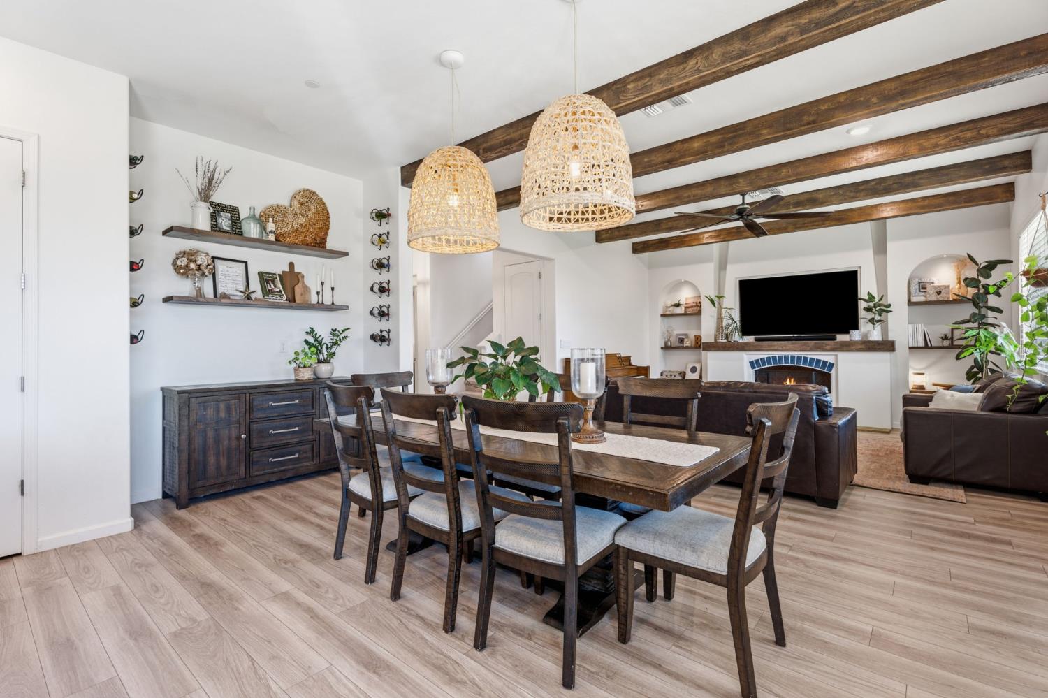 588 Overstone Avenue Madera, CA 93636 - Photo 12 of 65 a view of a dining room with furniture and wooden floor