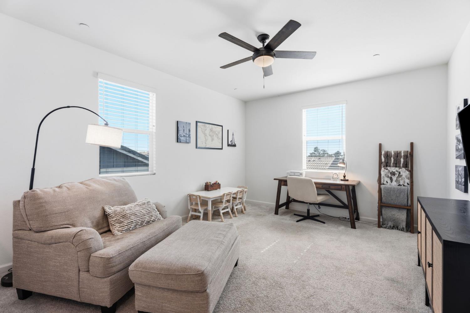 588 Overstone Avenue Madera, CA 93636 - Photo 21 of 65 a living room with furniture and a window