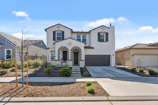 a kitchen with a table and chairs in it