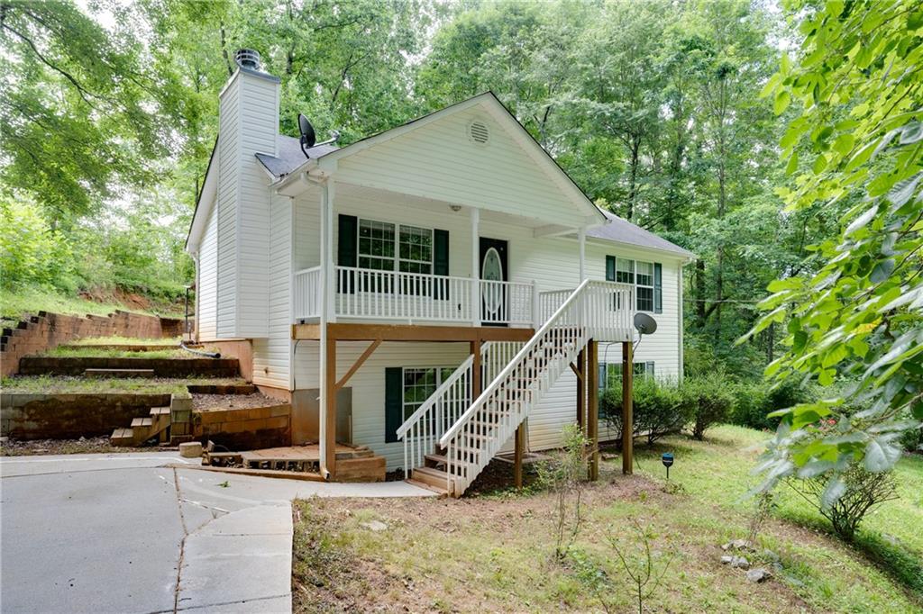 4925 Wisdom Road Cumming, GA 30041 - Photo 1 of 1 a view of a house with backyard