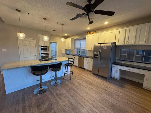 a view of a livingroom with furniture and windows