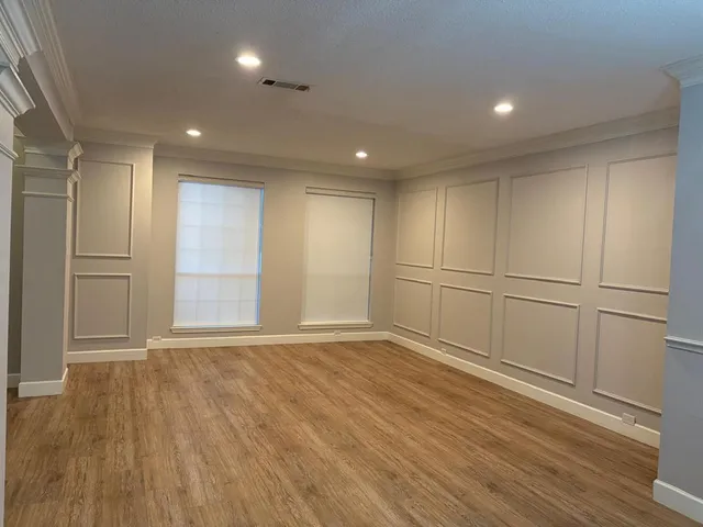 a bed room with a bed and a television