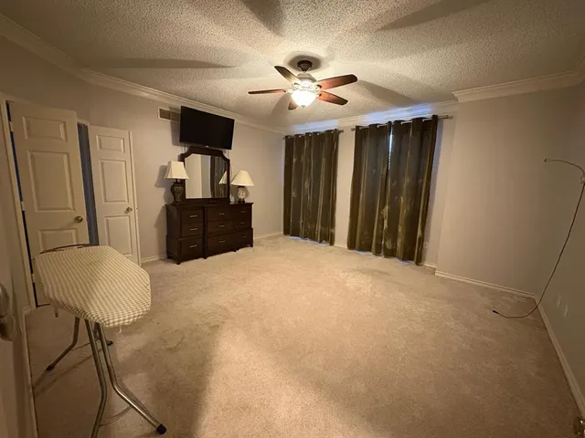 a view of a chandelier fan and closet