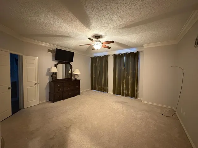 a spacious bathroom with a double vanity sink and a mirror