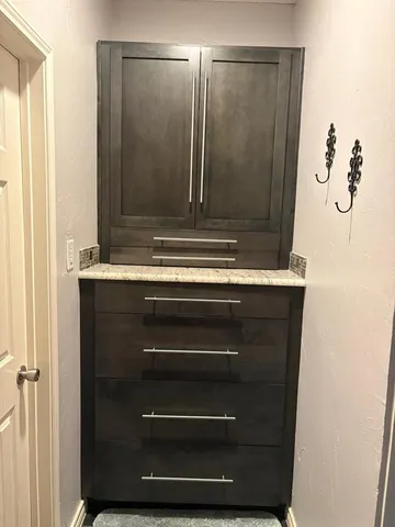 a bathroom with a double vanity sink and mirror