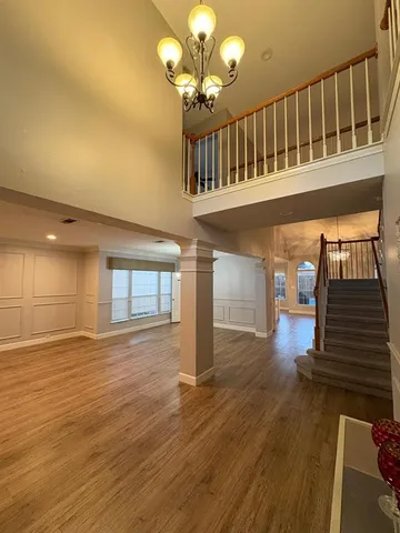 a view of an entryway with wooden floor