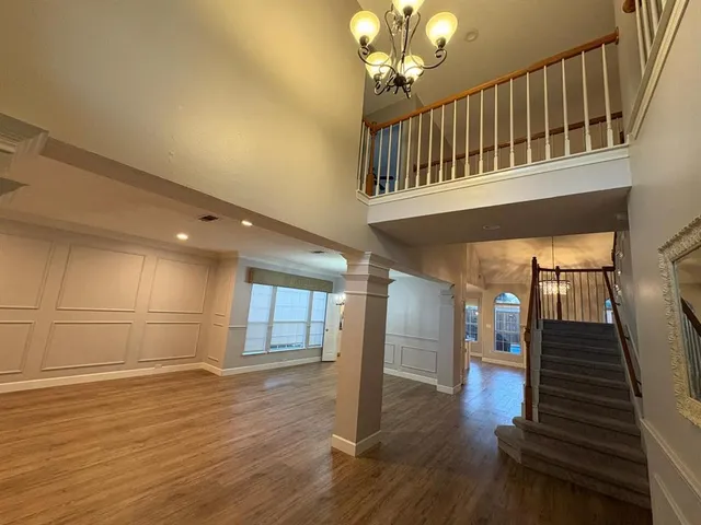 a view of an entryway with wooden floor