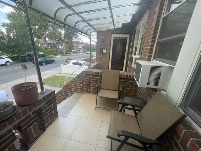 a view of a patio with a dining table and chairs