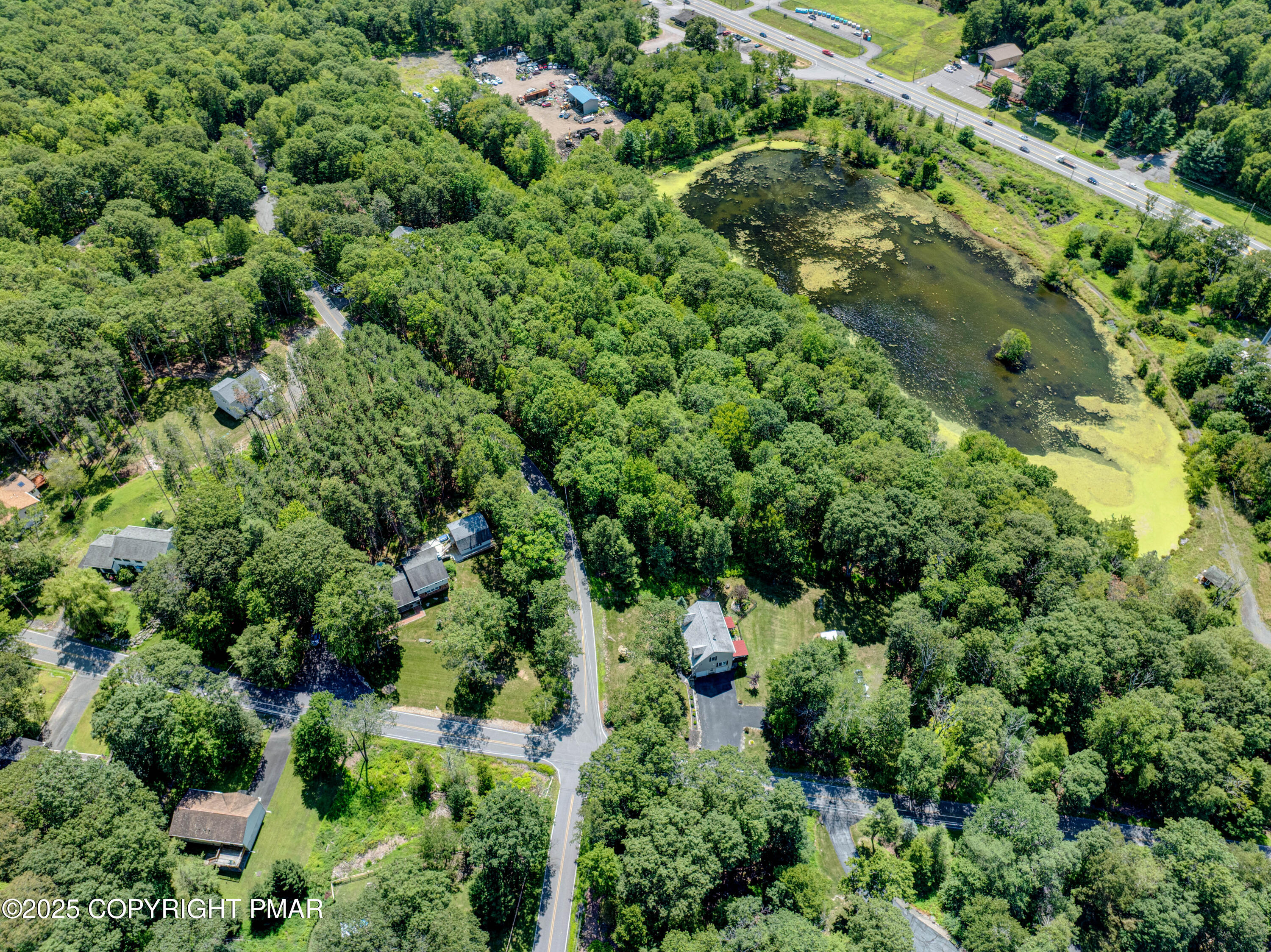 52 Rock Lane Swiftwater, PA 18370 - Photo 5 of 7 an aerial view of a house with a yard and outdoor space