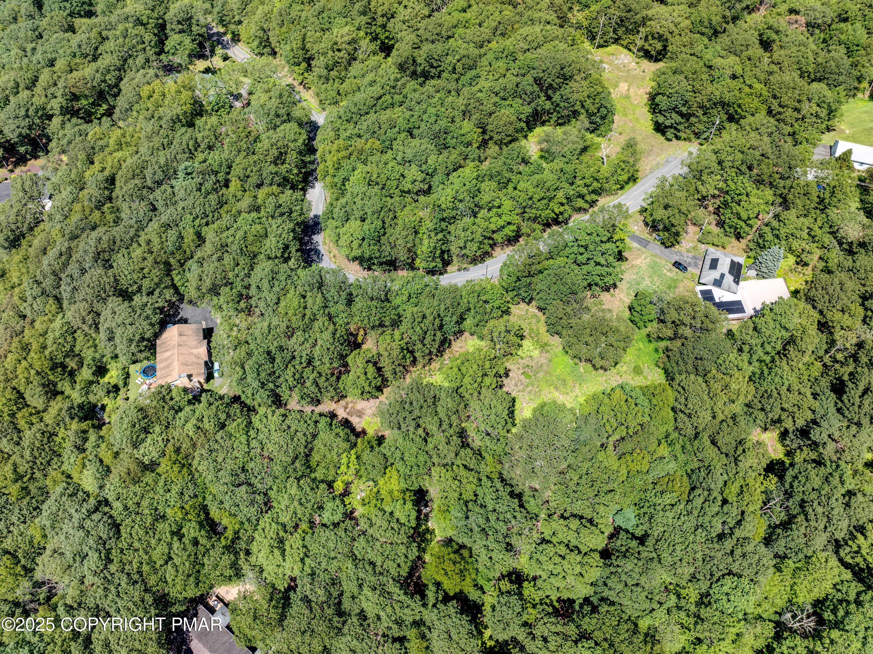 52 Rock Lane Swiftwater, PA 18370 - Photo 7 of 7 an aerial view of residential house with outdoor space and trees all around