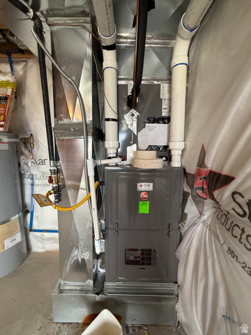 1823 South Longview Road Santaquin, UT 84655 - Photo 56 of 69 Gray Rheem furnace unit featuring exposed ductwork and PVC piping