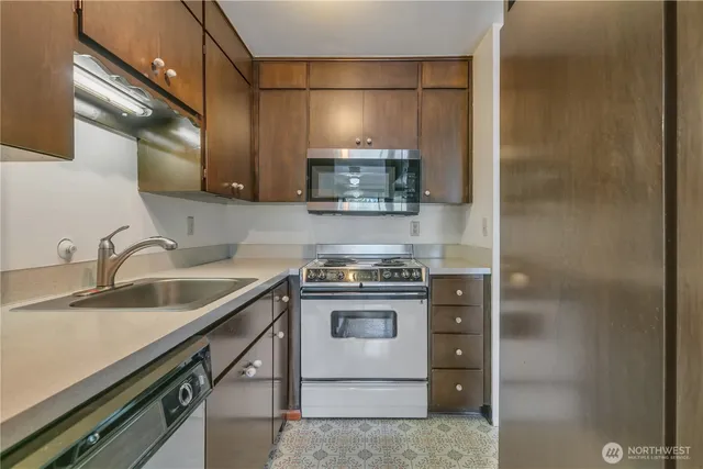 a kitchen with a stove and a sink