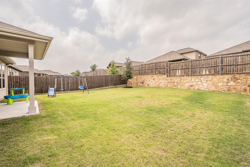 1212 Bosque Lane Weatherford, TX 76087 - Photo 36 of 38 a view of a swimming pool with a yard and a large tree