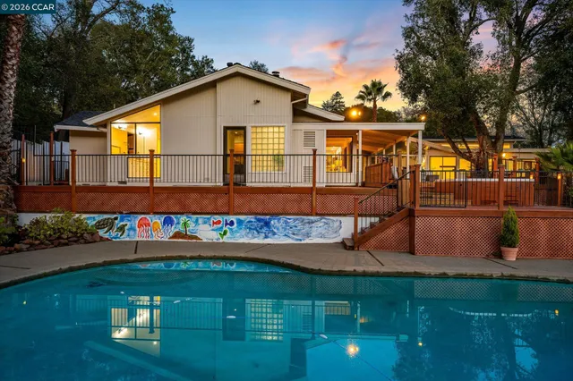 a pathway of a house with a yard