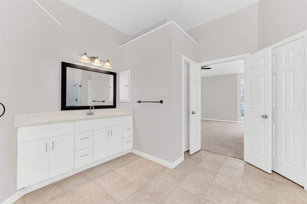 3500 Neiman Road Plano, TX 75025 - Photo 18 of 26 The large second vanity has additional storage and a medicine chest! The second walk-in closet is to the right of the main door.