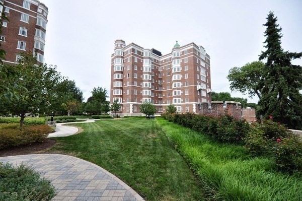 20 Chapel Street, Unit C308 Brookline, MA 02446 - Photo 15 of 15 a view of a big building next to a big yard and large trees