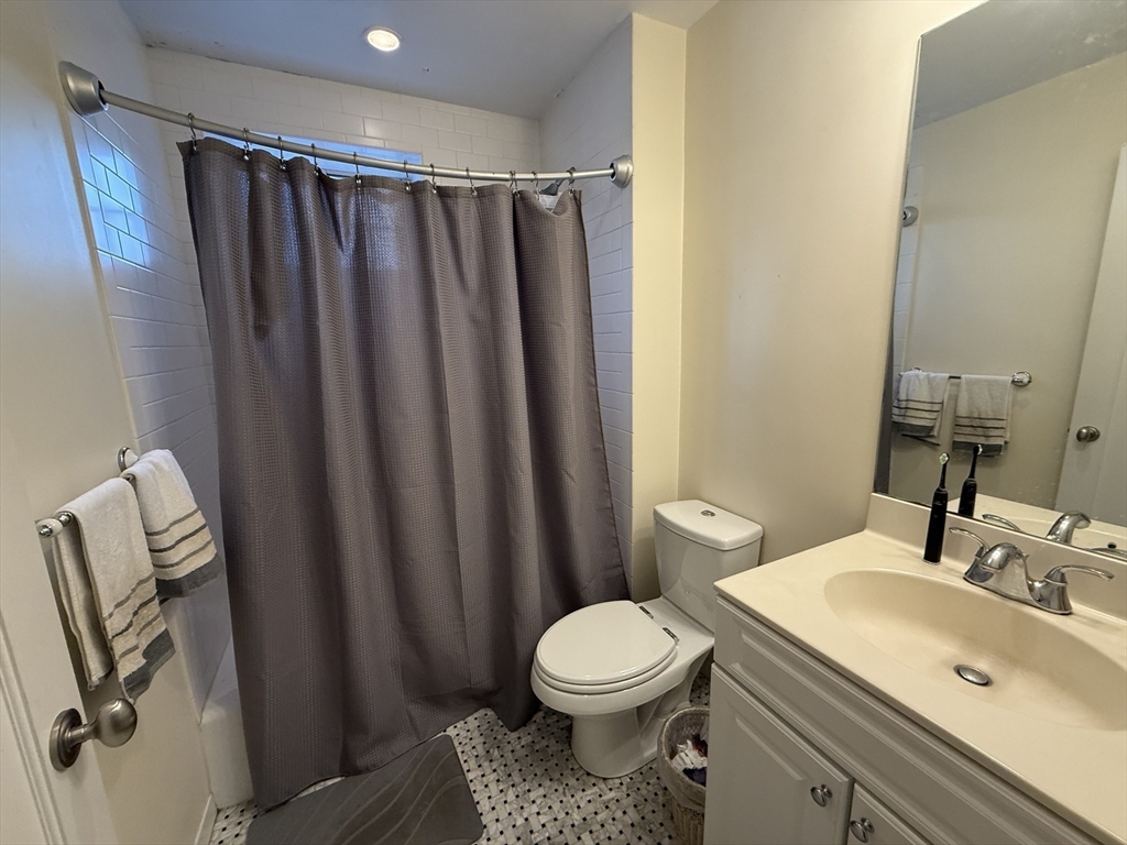 20 Chapel Street, Unit C308 Brookline, MA 02446 - Photo 9 of 15 a bathroom with a sink and a toilet