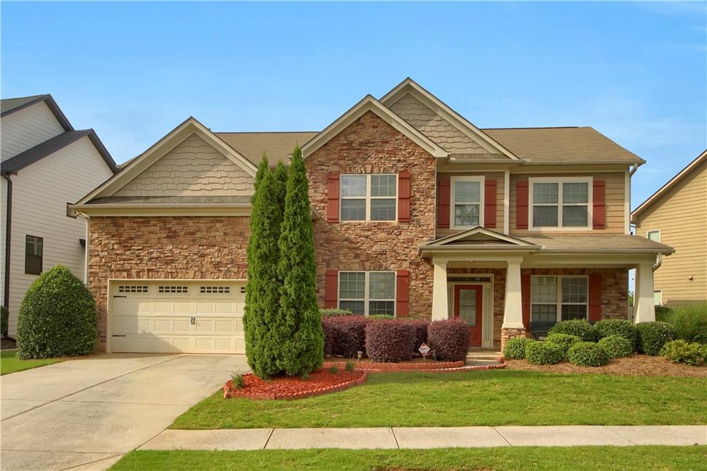 a front view of a house with a yard