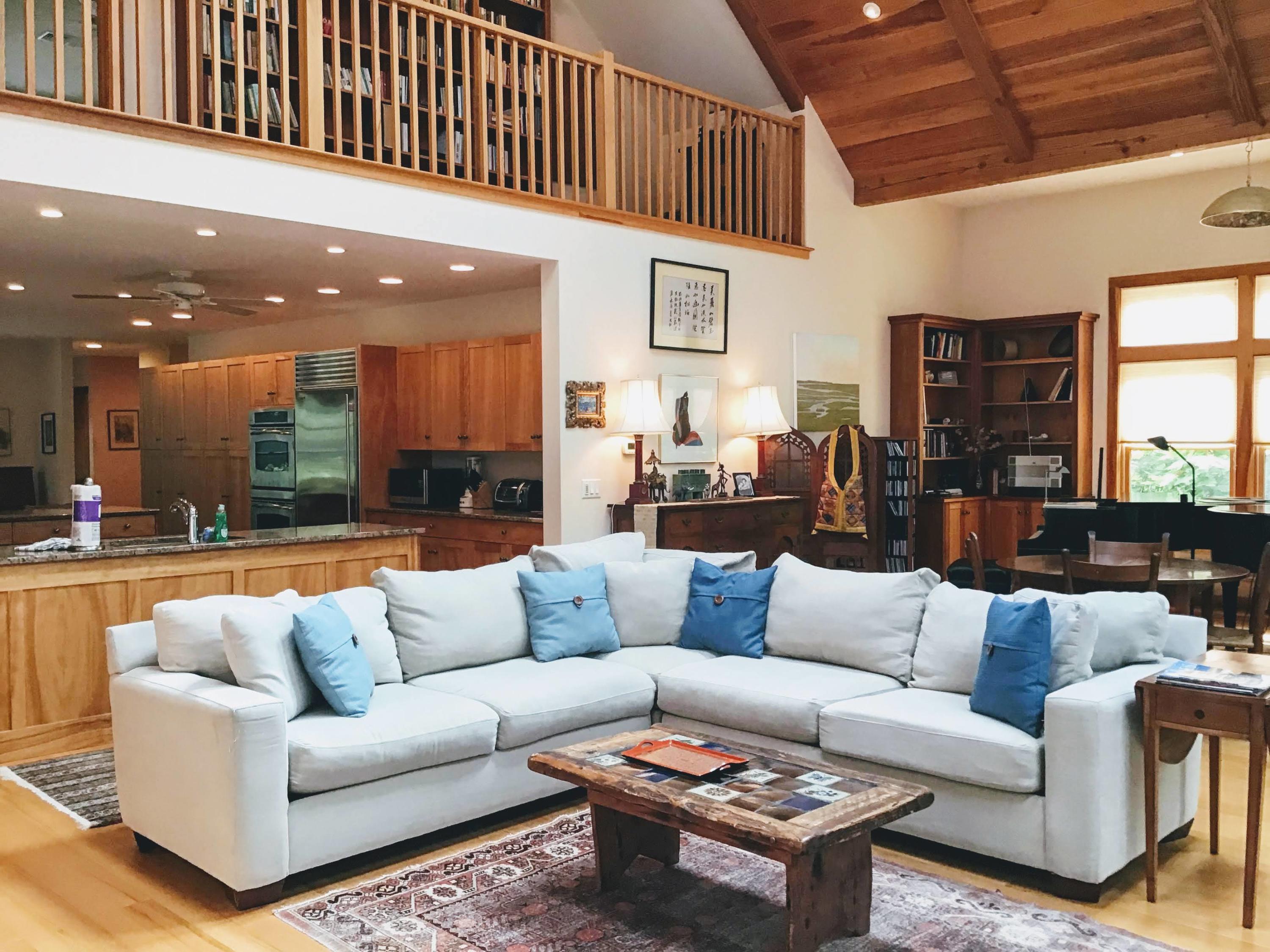 150 Tonset Road Orleans, MA 02653 - Photo 12 of 54 a living room with furniture kitchen view and a chandelier