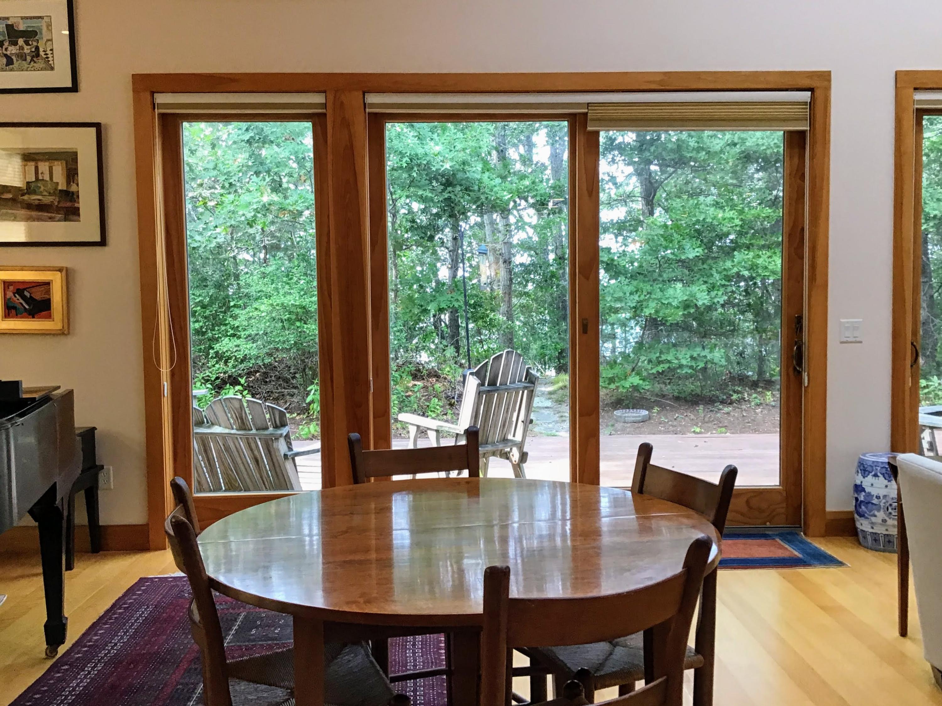 150 Tonset Road Orleans, MA 02653 - Photo 16 of 54 a dining room with furniture window and wooden floor