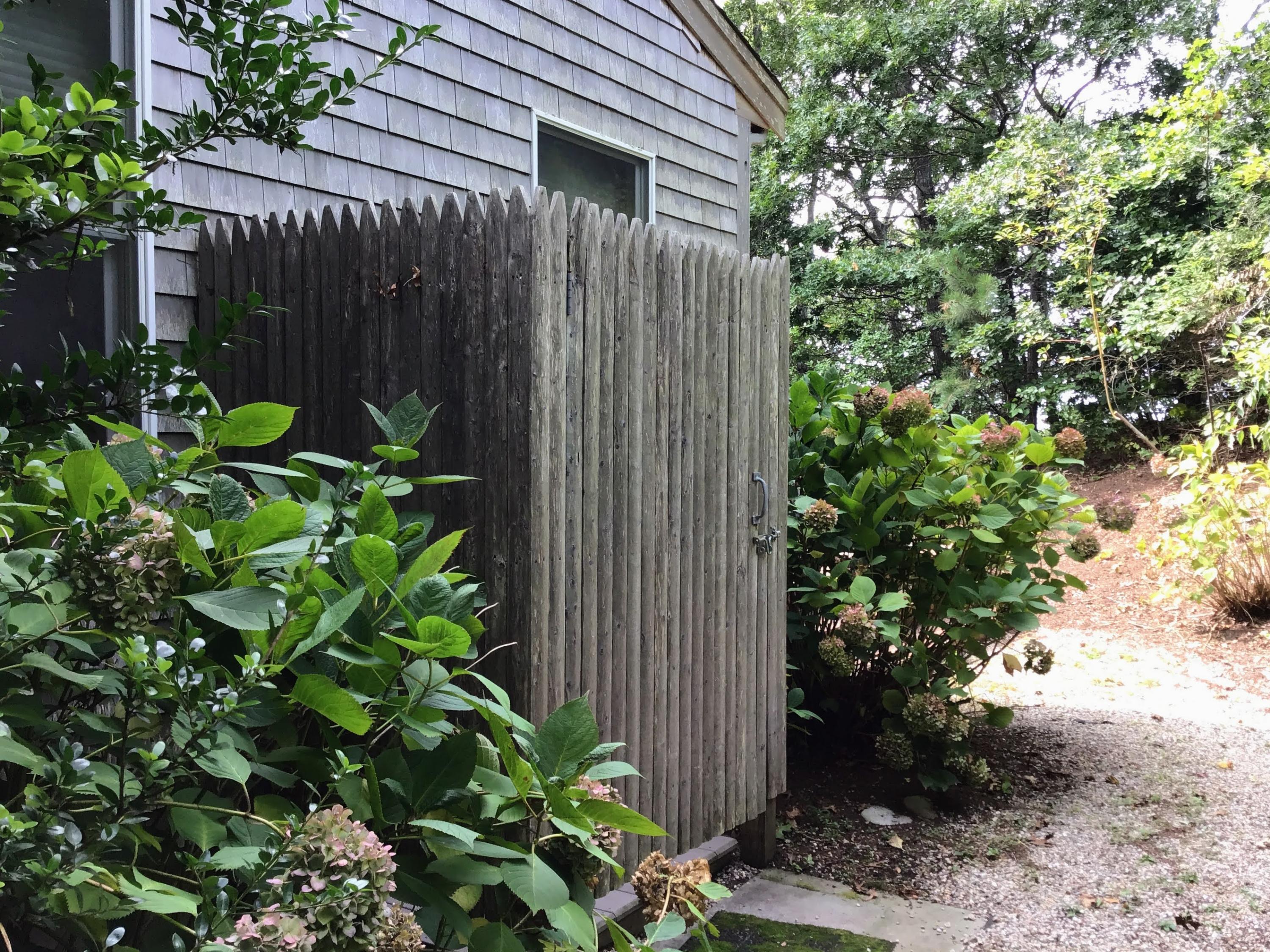 150 Tonset Road Orleans, MA 02653 - Photo 50 of 54 a backyard of a house with lots of green space